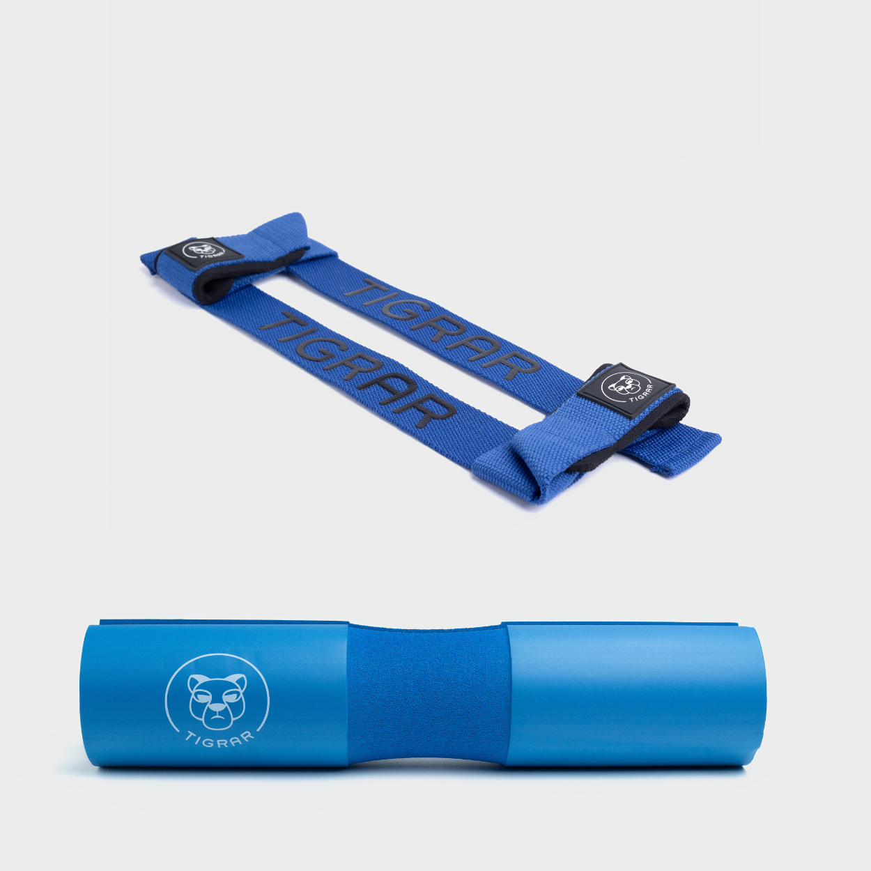 Uniforme combinatie van Tigrar blauwe lifting straps en barbell pad, beide voor maximale bescherming en ondersteuning.