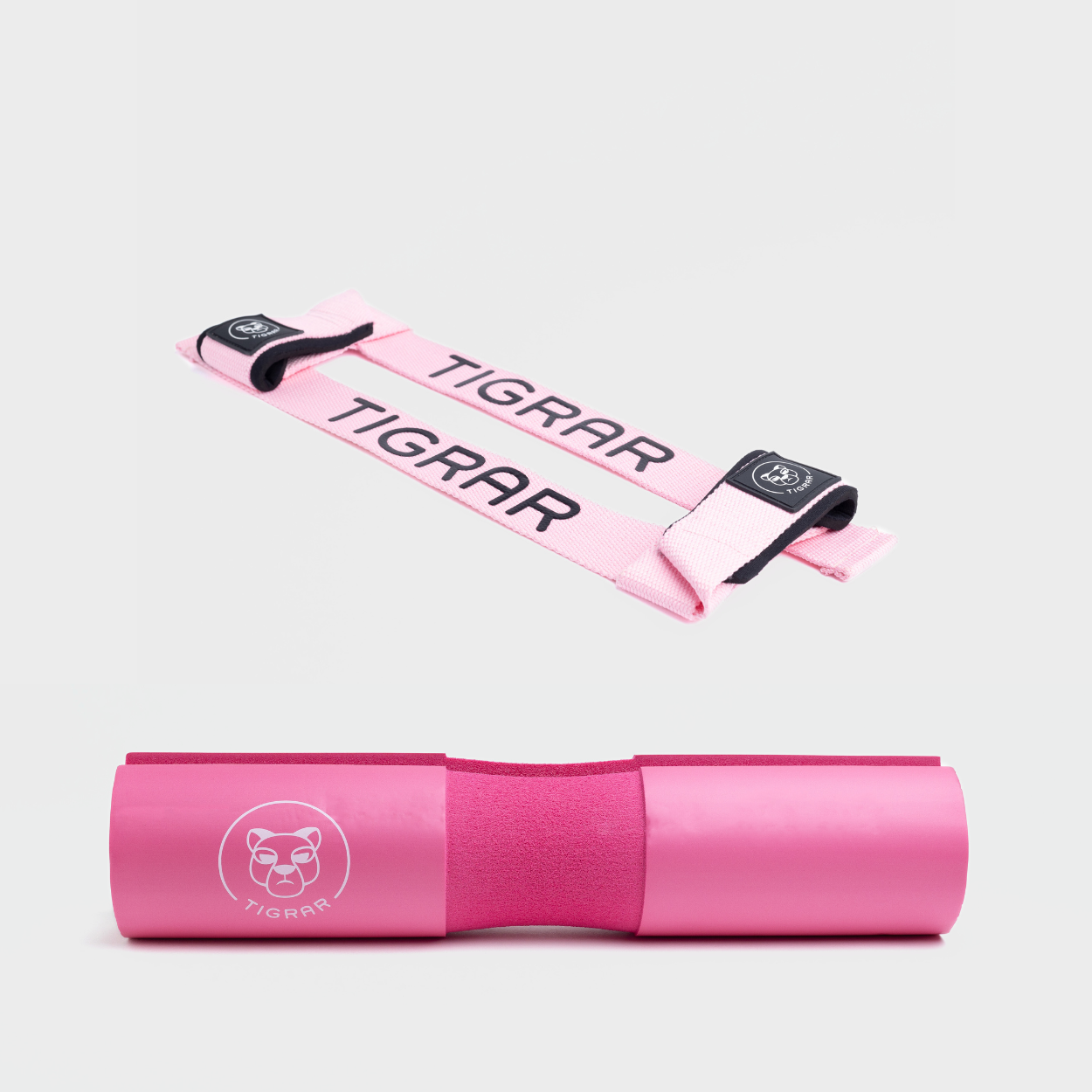 Matchende roze Tigrar lifting straps en barbell pad, combineren slijtvast materiaal met dubbele padding voor comfort.