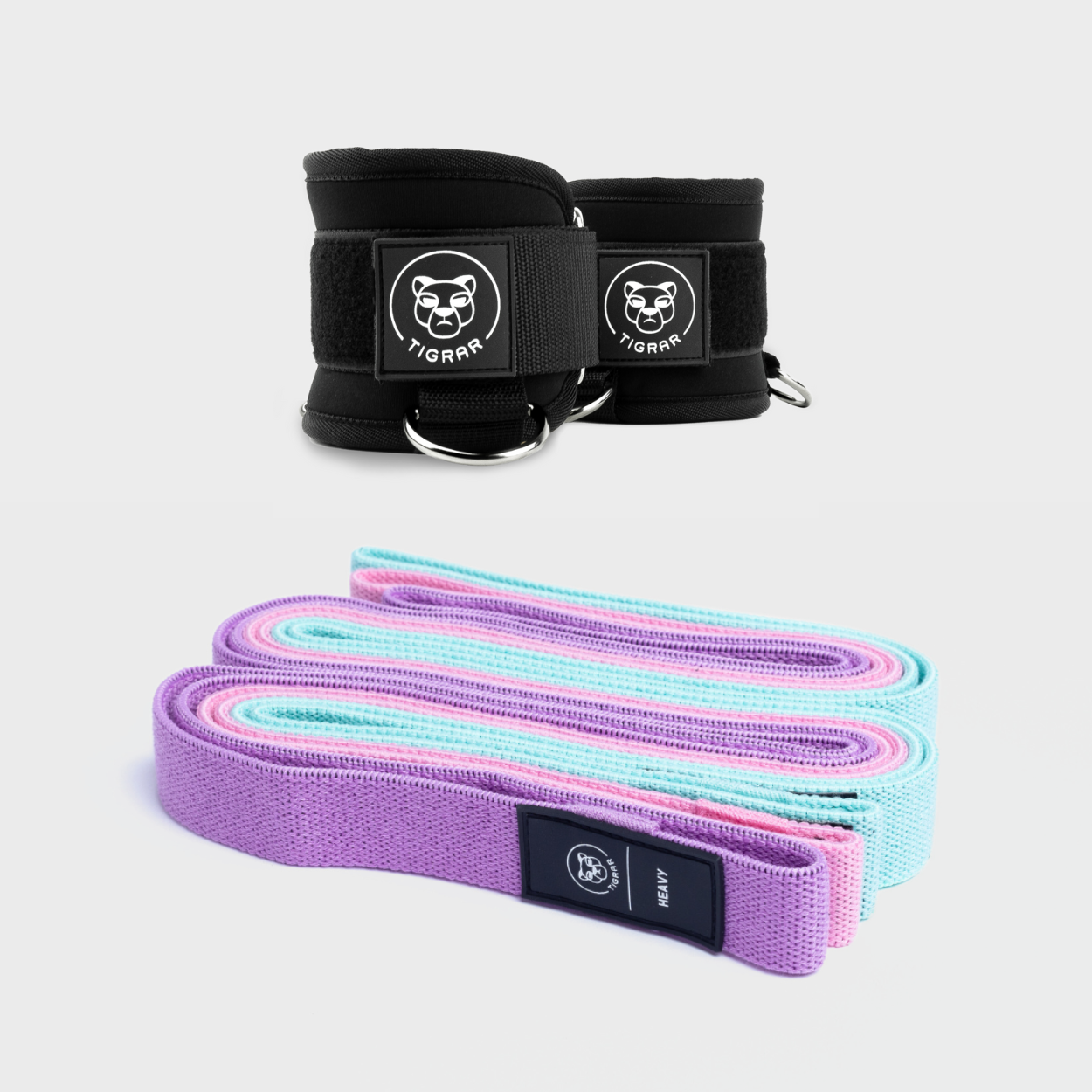 Tigrar functional training set met elastiek banden in mintgroen, roze en paars, en neopreen gym ankle straps met comfortabele padding en stevige ringen