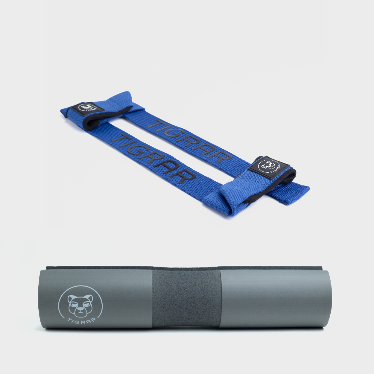 Blauwe Tigrar lifting straps en grijze barbell pad, beide ontworpen voor grip en comfort, ideaal voor deadlifts.