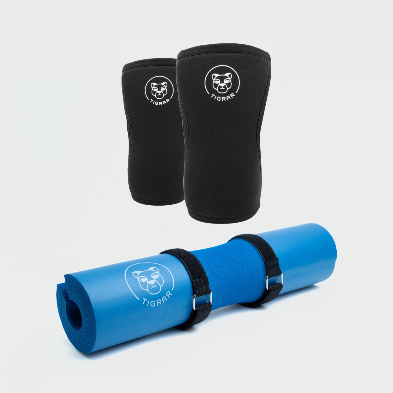 Optimaliseer je krachttraining met Tigrar's zwarte knee sleeves en blauwe barbell pad, een essentiële set voor bescherming en comfort tijdens elke oefening.