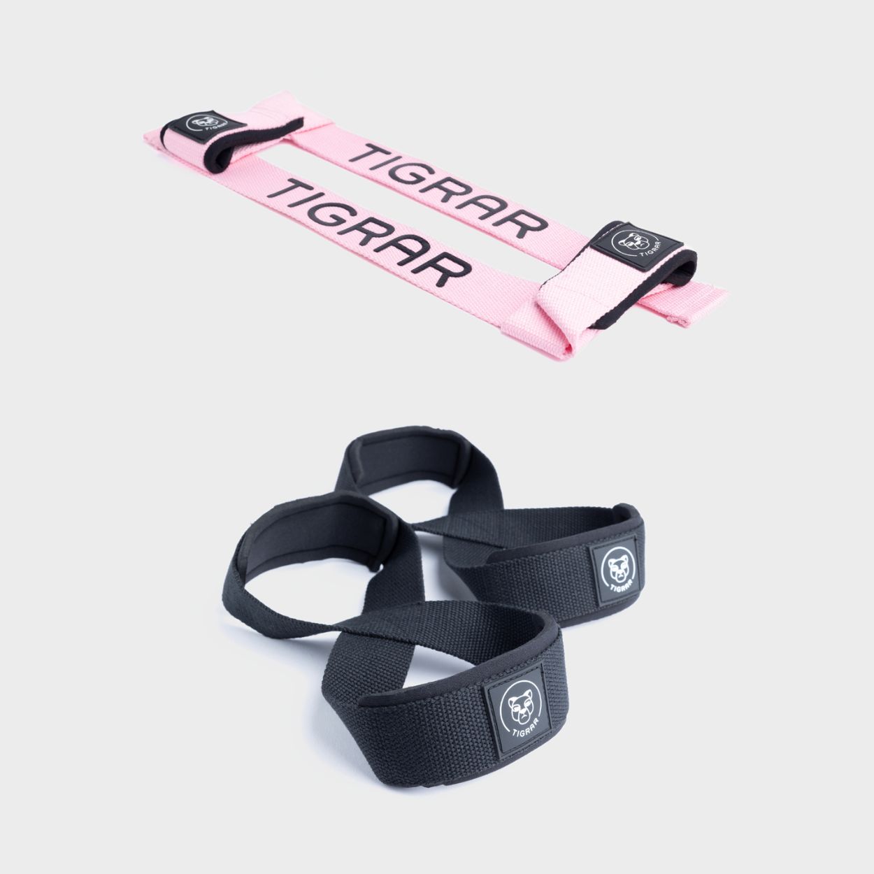 Roze lifting straps met zwarte figure 8 straps, biedt stijl en kracht voor weightlifting.