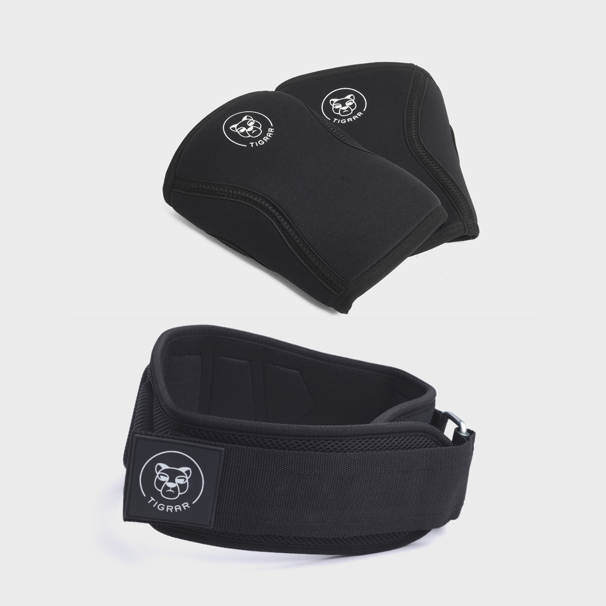 Gym-ready Tigrar bundel: High-performance knee sleeves en lifting belt voor in de sportschool.