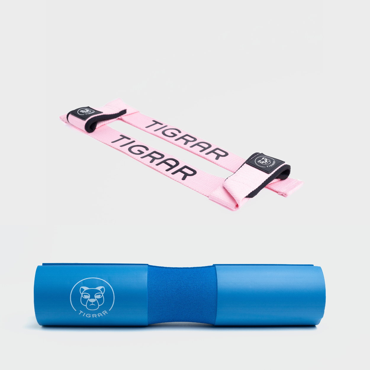 Roze Tigrar lifting straps met blauwe barbell pad, ideaal voor verhoogde veiligheid en steun bij elke lift.