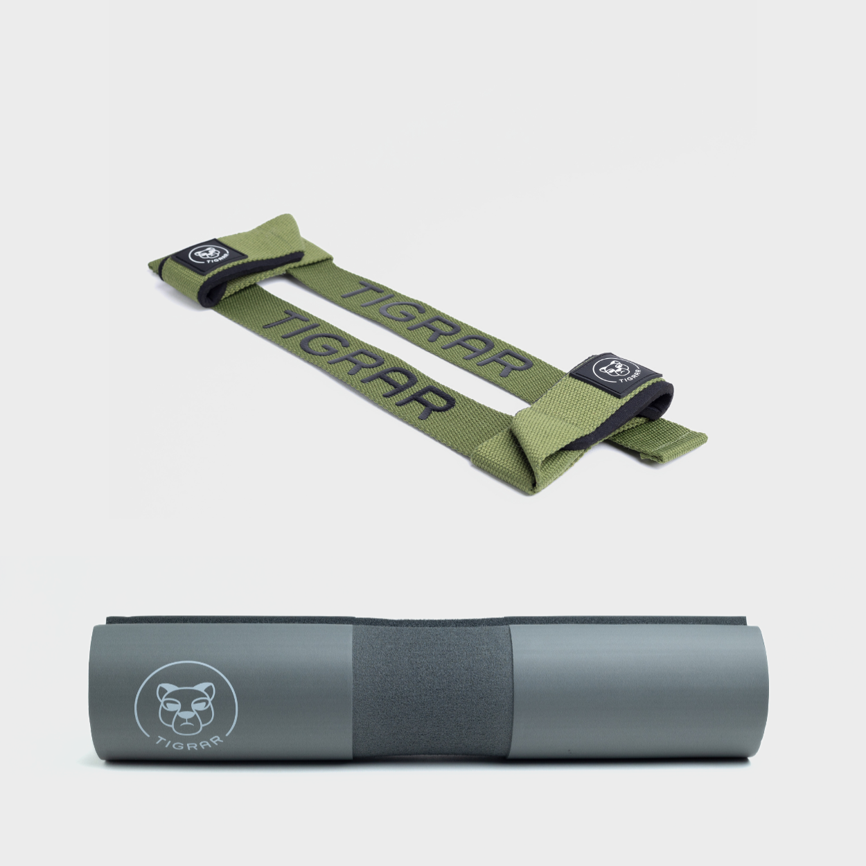Groene Tigrar lifting straps en grijze barbell pad, ideaal voor veilige training met hun anti-slip ontwerp.