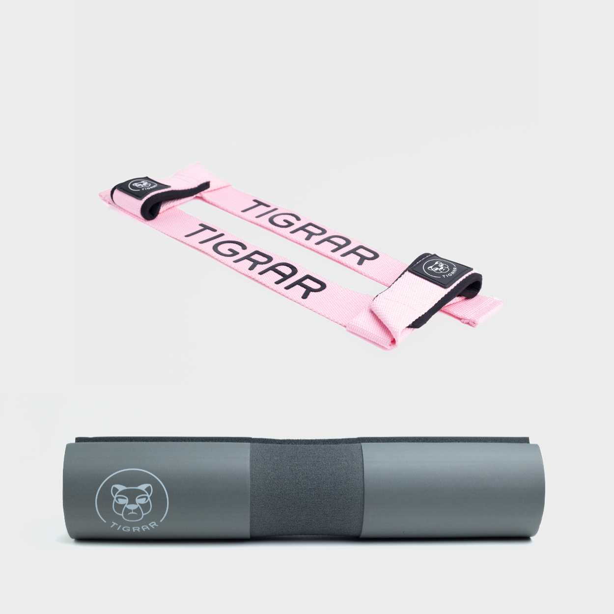 Roze Tigrar lifting straps en grijze barbell pad, ontworpen voor comfort en stabiliteit, perfect voor squats