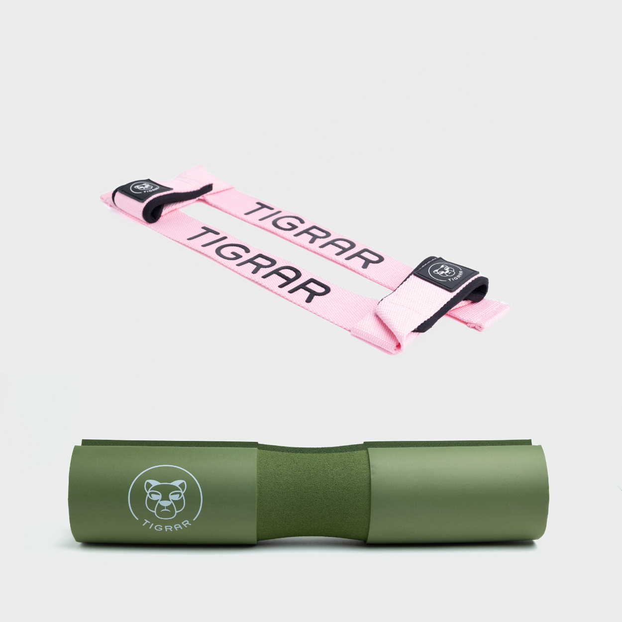 Levendige roze lifting straps en groene Tigrar barbell pad, voor duurzame prestaties en comfort tijdens trainingen.