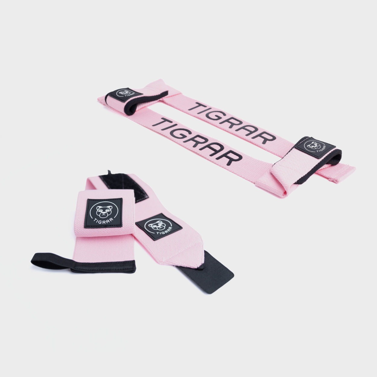 Set roze wrist wraps en lifting straps van Tigrar voor verbeterde grip en polssteun tijdens krachttraining