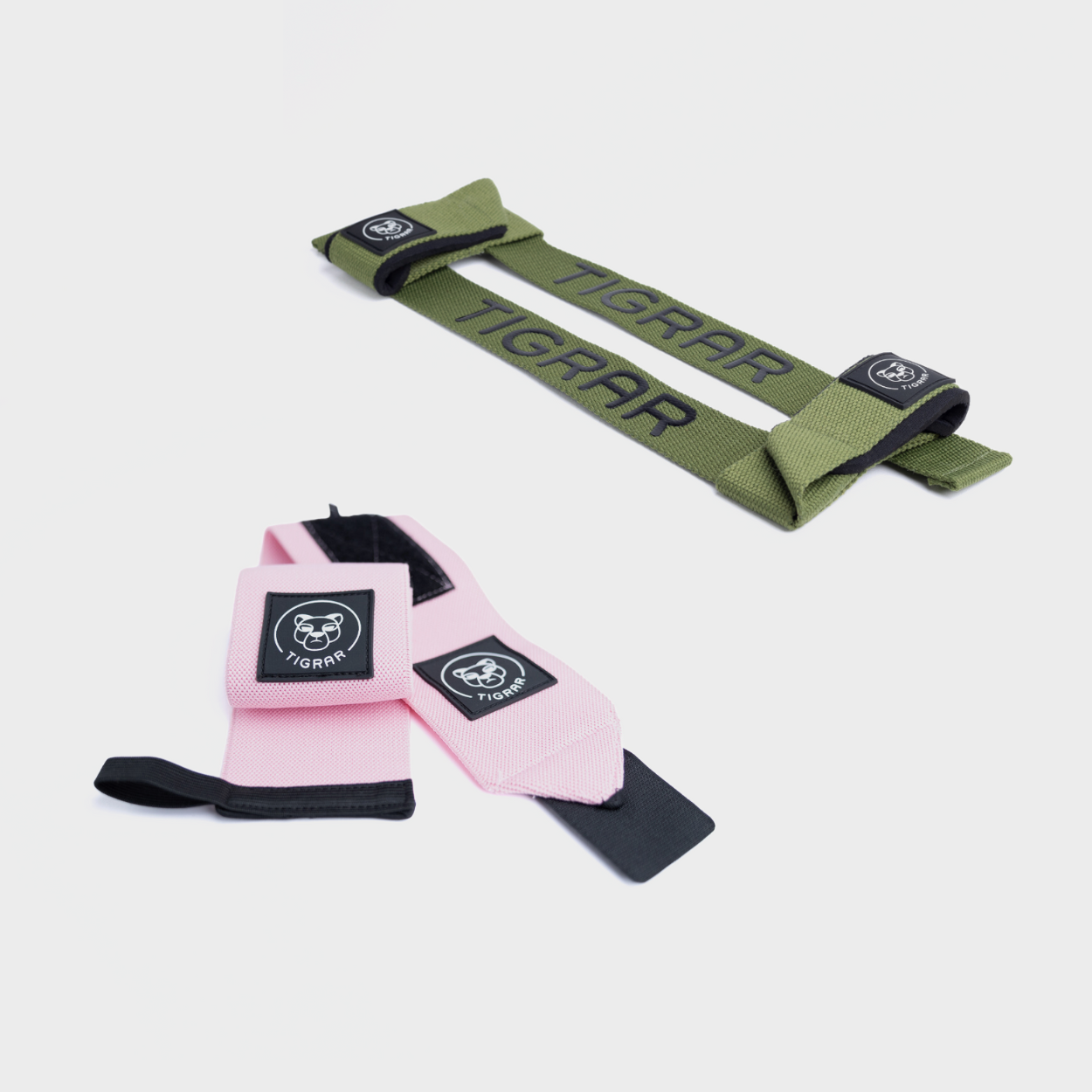 Roze wrist wraps en groene padded lifting straps van Tigrar voor comfort en ondersteuning bij zware krachttraining