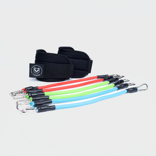 Compleet overzicht van de Tigrar Ankle Resistance Kit, inclusief enkel straps en resistance tubes.
