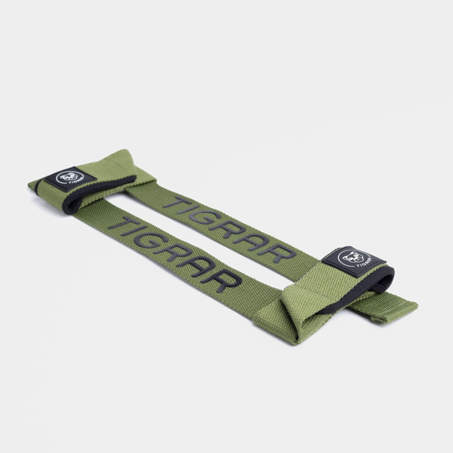 Groene Tigrar lifting straps in close-up, benadrukken duurzaamheid en gemakkelijke verstelbaarheid voor diverse workouts.
