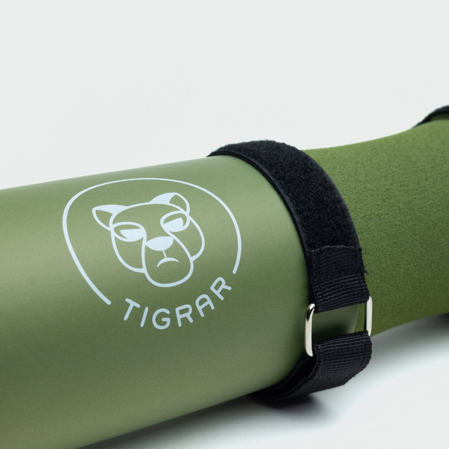 Close-up van groene Tigrar gym barbell pad met stevige bevestiging
