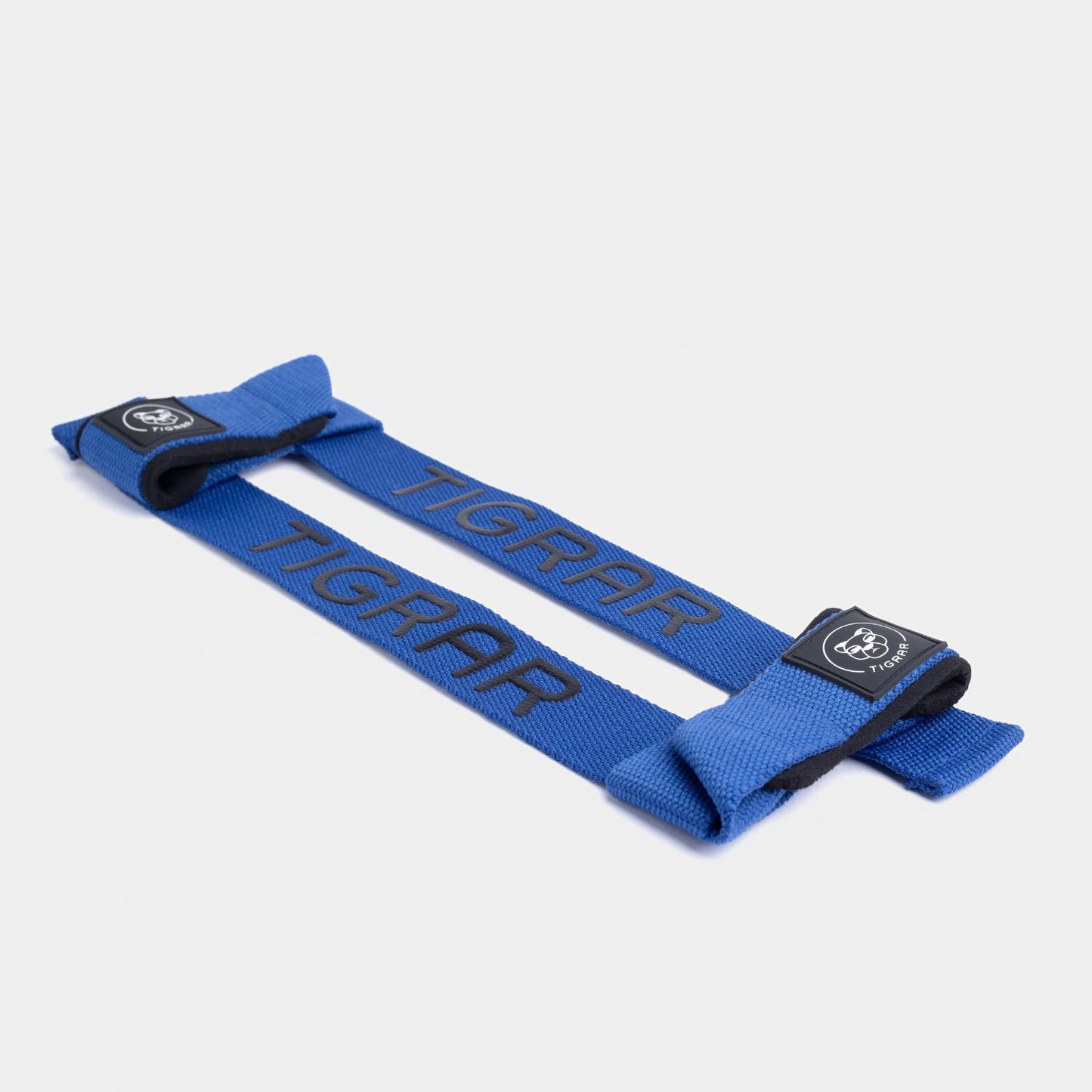Gedetailleerde weergave van blauwe Tigrar silicone lifting straps, benadrukt slijtvaste materialen en comfortabele padding.