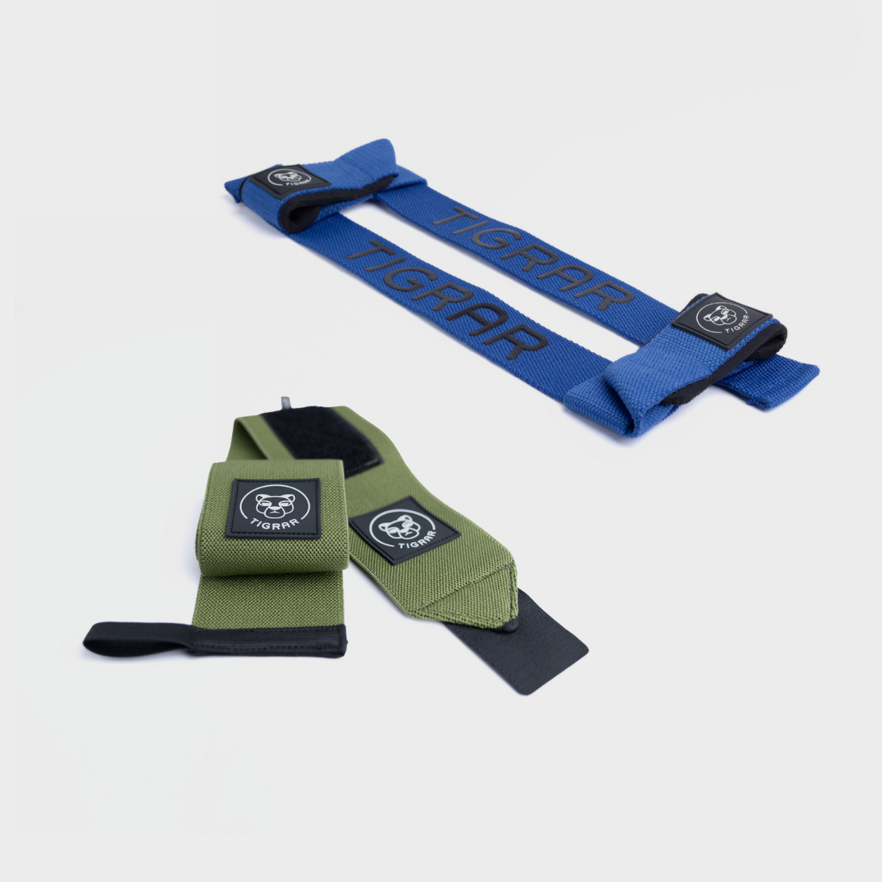 Set Tigrar groene wrist straps en blauwe weight lifting straps van nylon, ideaal voor intensieve trainingen zoals rows en shoulder presses.