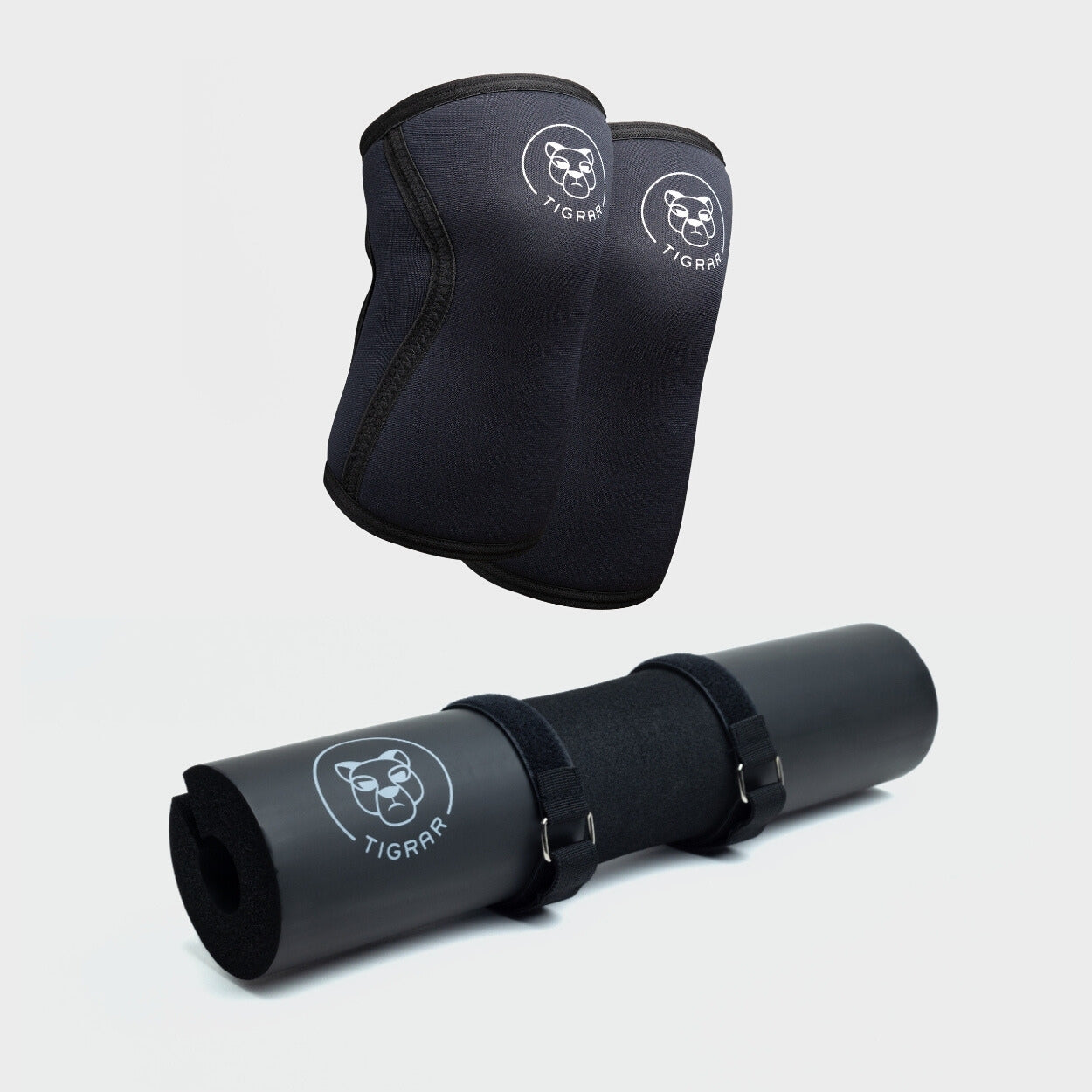 De combinatie van Tigrar's zwarte knee sleeves en een zwarte barbell pad getoond, een perfecte set voor elke fitnessliefhebber.