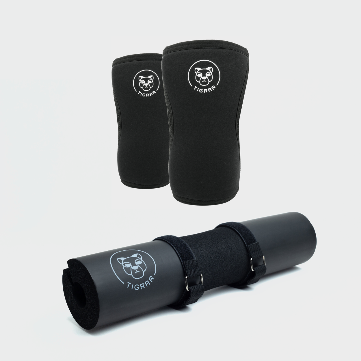 De combinatie van Tigrar's zwarte knee sleeves en een zwarte barbell pad getoond, een perfecte set voor elke fitnessliefhebber.