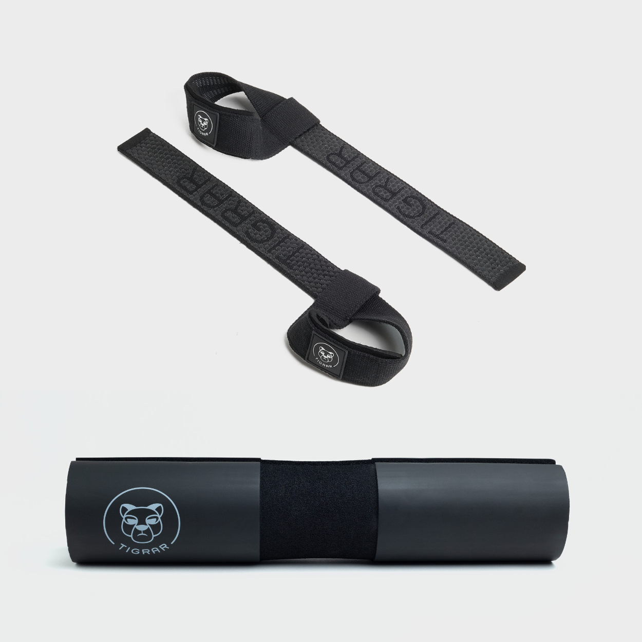 Professionele set van zwarte Tigrar lifting straps en barbell pad, ontworpen voor superieur comfort en grip tijdens powerlifts.