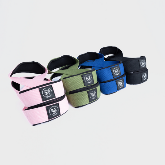 Vier kleur varianten van Tigrar figure 8 lifting straps op één foto, toont diversiteit in aanbod.