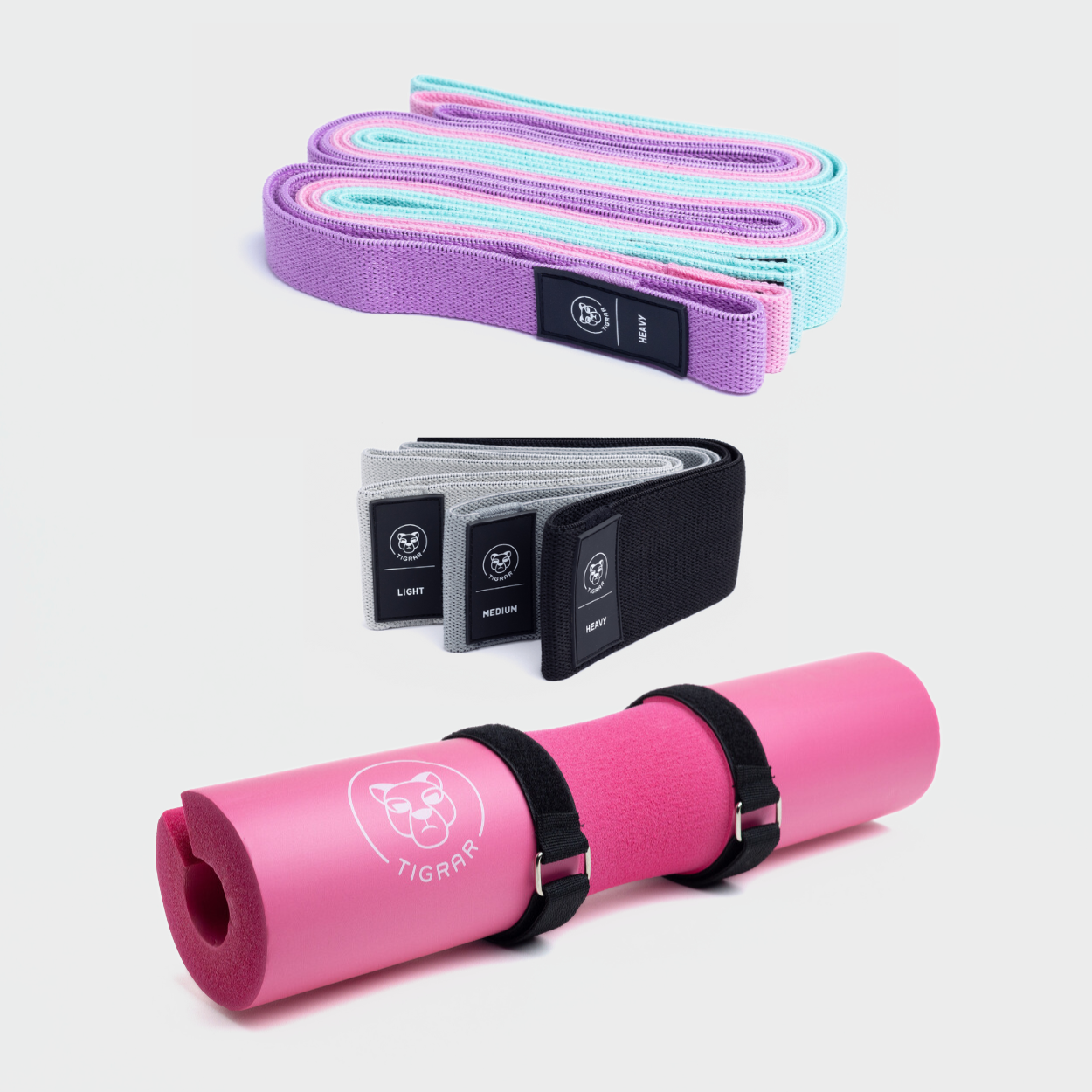 Roze barbell bar pad met korte en lange weerstandsbanden in verschillende kleuren