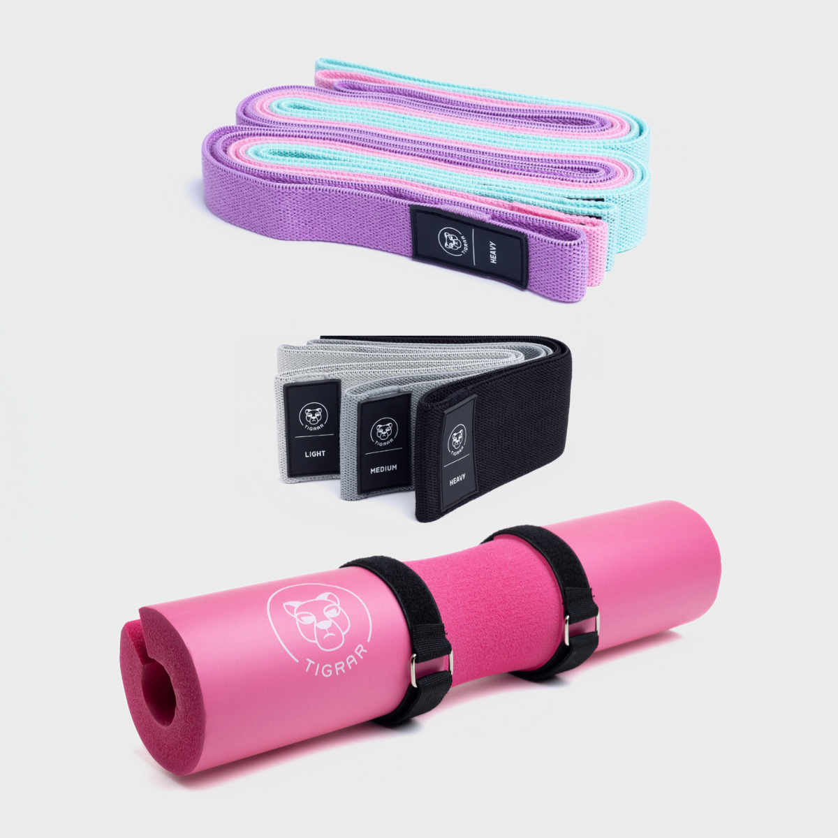 Roze barbell bar pad met korte en lange weerstandsbanden in verschillende kleuren