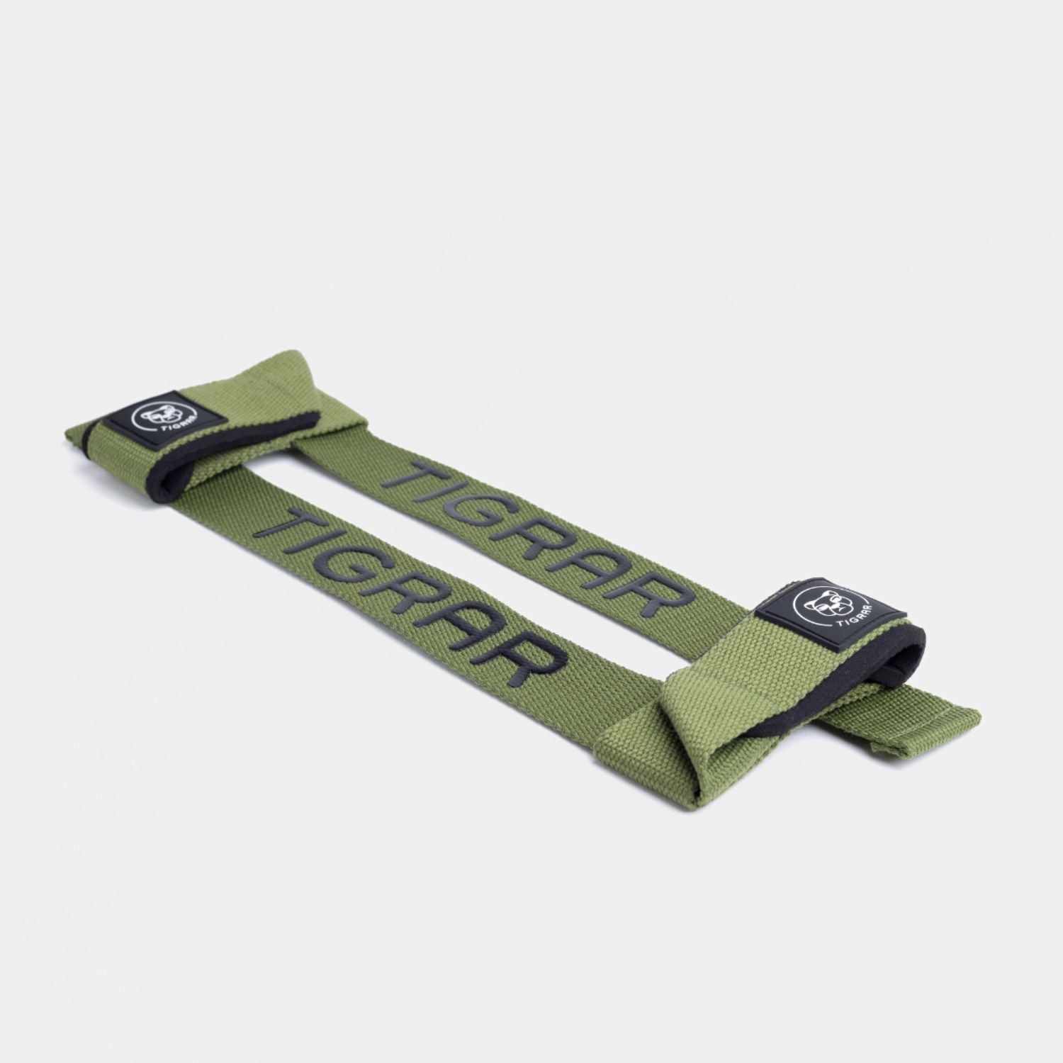 Groene Tigrar lifting straps in close-up, benadrukken duurzaamheid en gemakkelijke verstelbaarheid voor diverse workouts.