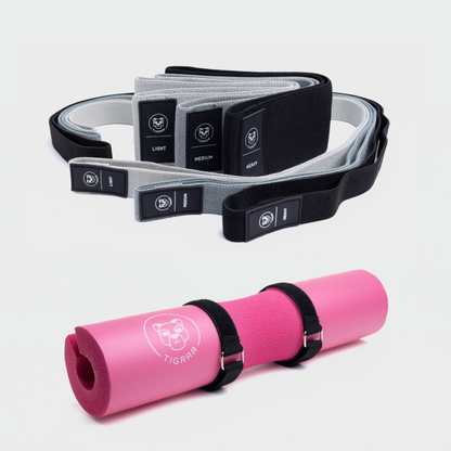 Roze Tigrar barbell pad met drie korte en drie lange weerstandsbanden. Weerstand variërend van light tot heavy, in zwart, grijs en lichtgrijs.