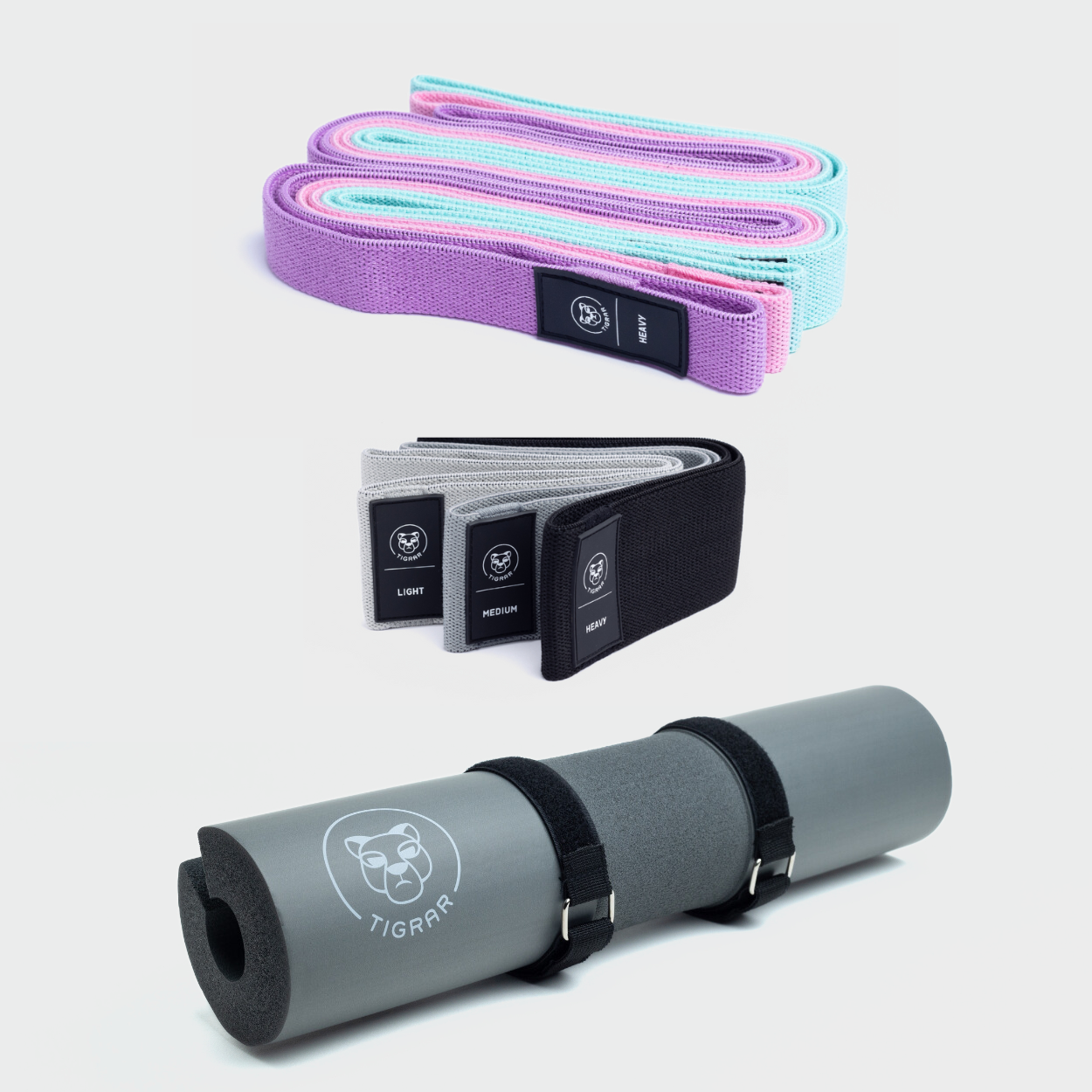 Grijze Tigrar barbell pad met drie lange gekleurde en drie korte donkere weerstandsbanden.