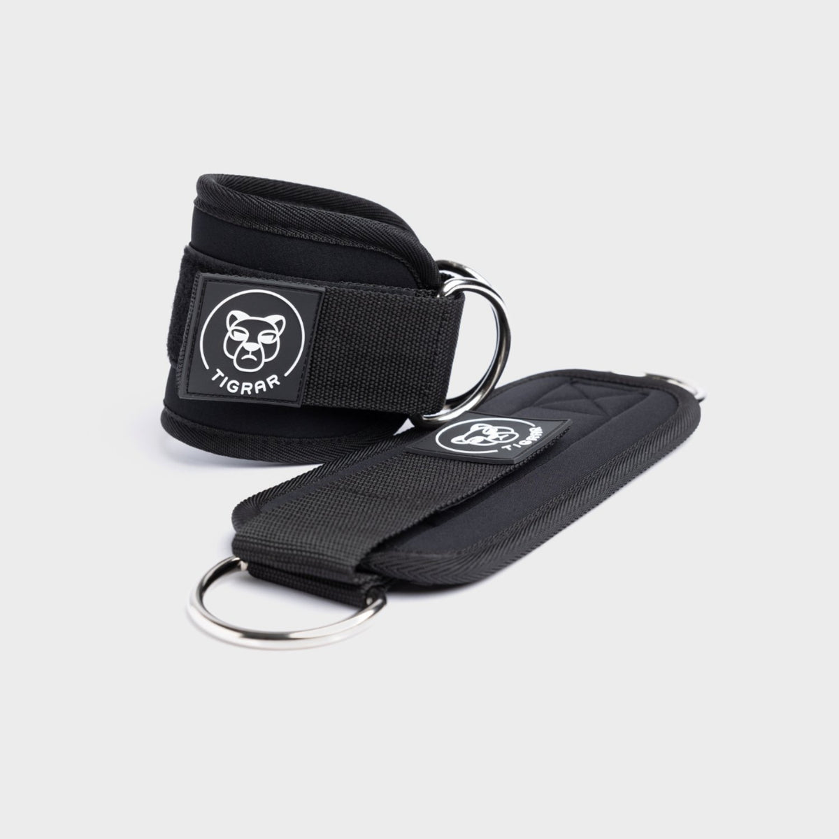 Zwarte Tigrar ankle straps gym met lichtgewicht design, ontworpen voor stabiliteit en dagelijks gebruik.