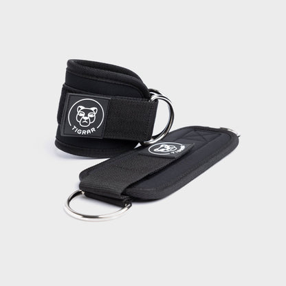 Zwarte Tigrar ankle straps gym met lichtgewicht design, ontworpen voor stabiliteit en dagelijks gebruik.