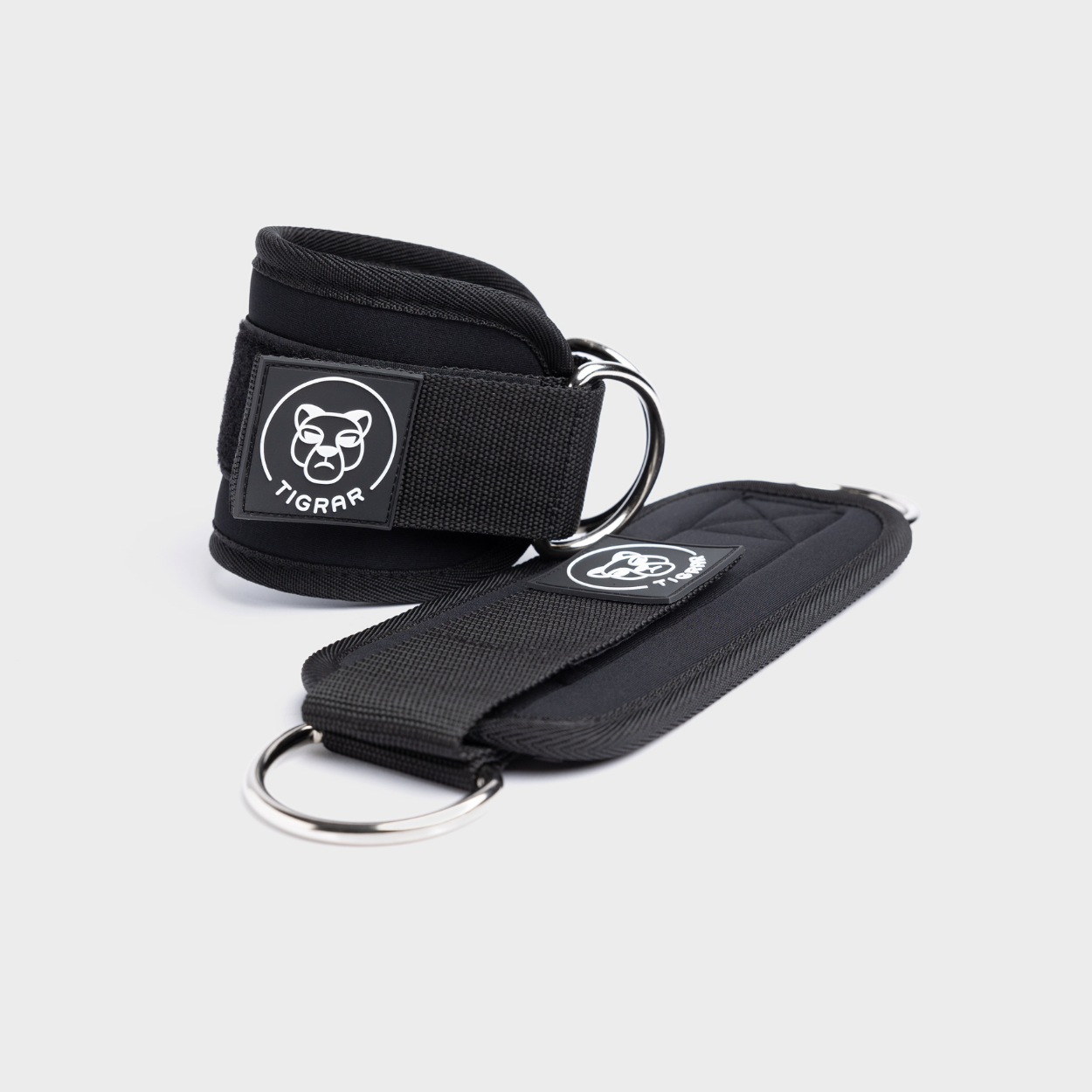 Zwarte Tigrar ankle straps met klittenbandsluiting, lichtgewicht en comfortabel, geschikt voor dagelijkse stabiliteitsoefeningen.