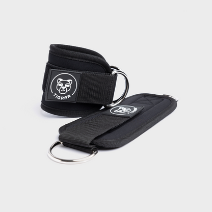 Zwarte Tigrar ankle straps met klittenbandsluiting, lichtgewicht en comfortabel, geschikt voor dagelijkse stabiliteitsoefeningen.