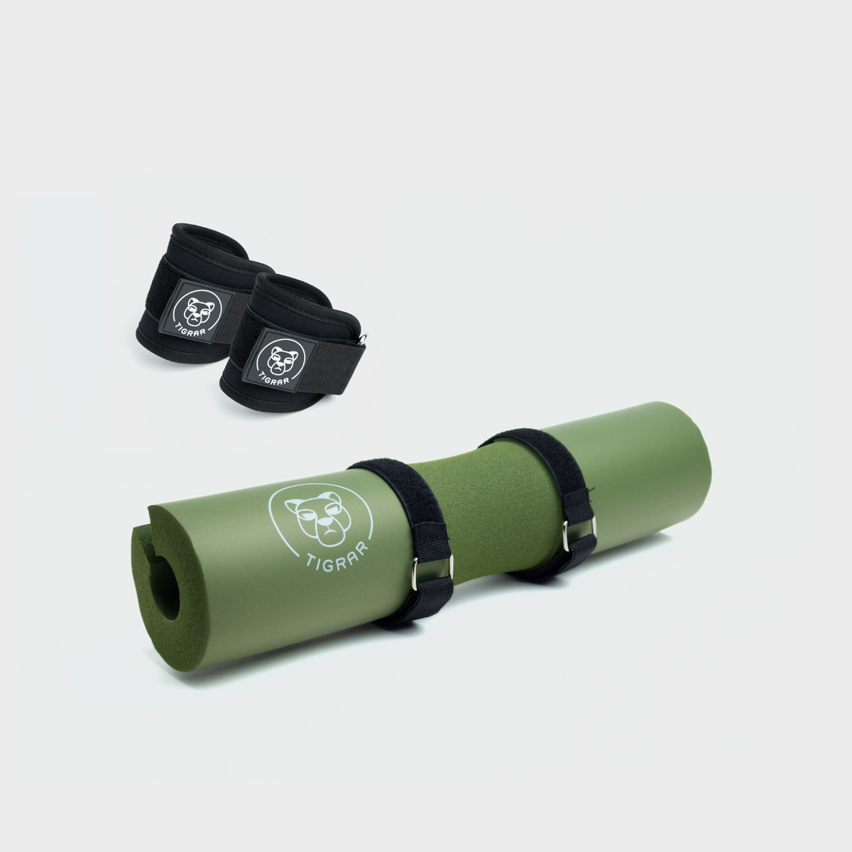 Tigrar set met Groene hip thrust foam pad en zwarte enkel straps voor zware lifts.